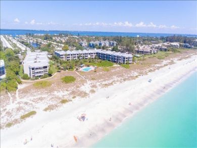 Just Steps to the Sandy Beach from this Two Bedroom Condo